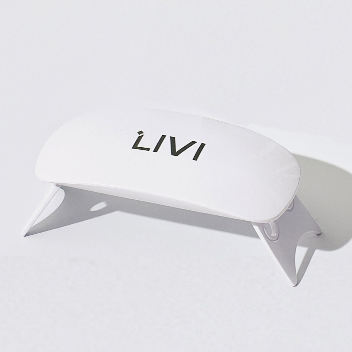 White uv lamp with 'LIVI' branding on a light gray background
