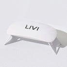 White uv lamp with 'LIVI' branding on a light gray background
