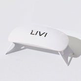 White uv lamp with 'LIVI' branding on a light gray background